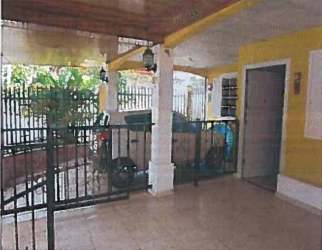 Covered patio with tiled floor, garden space, iron fencing corner house Green Village Vista Alegre Panama