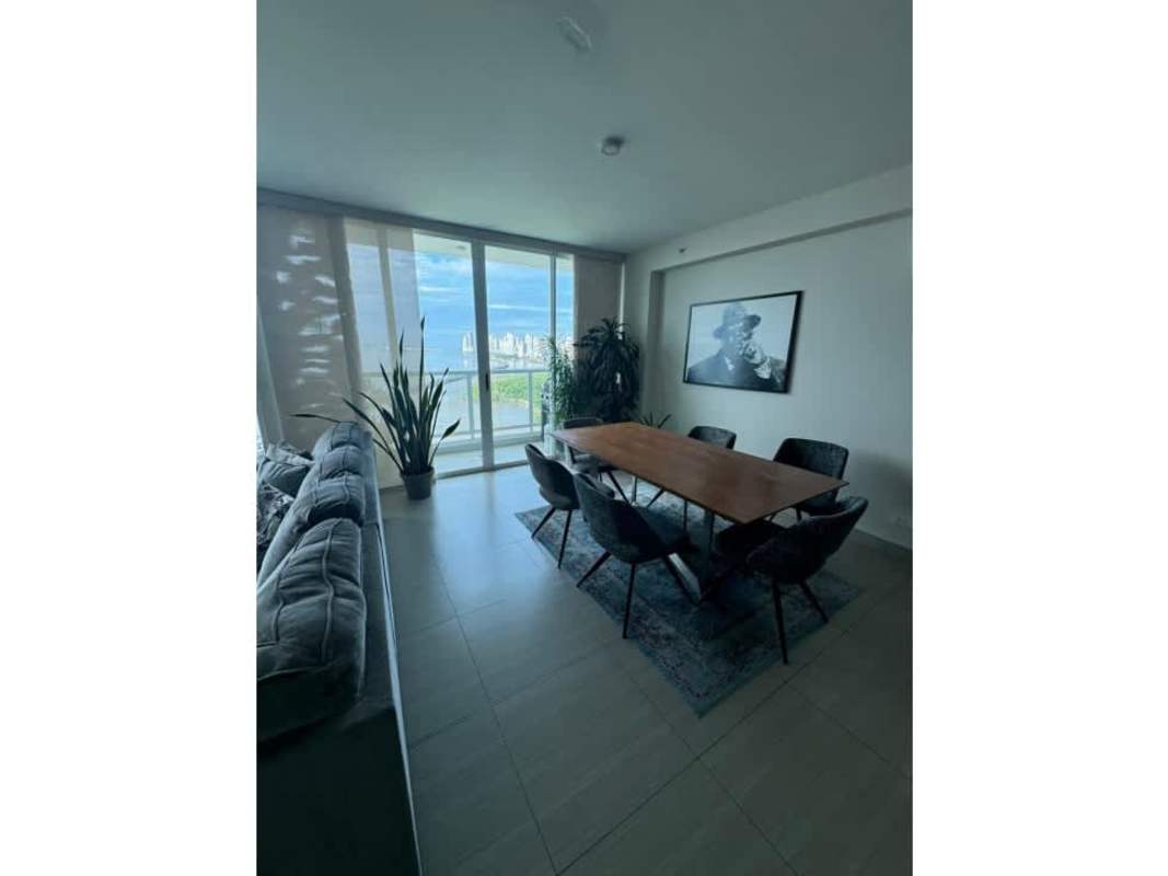 Modern living area with sectional sofa ocean view and floor-to-ceiling windows PH Asia Panama