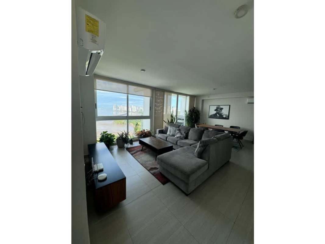 Spacious living room with panoramic windows and view of ocean and city in PH Asia Costa del Este Panama