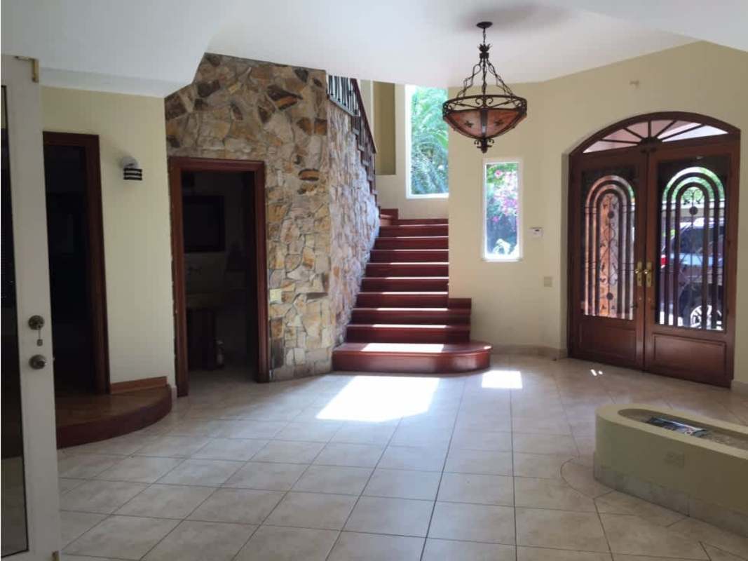 Luxury Mediterranean style house with stone accents, arched entrance in Loma Alegre San Francisco Panama