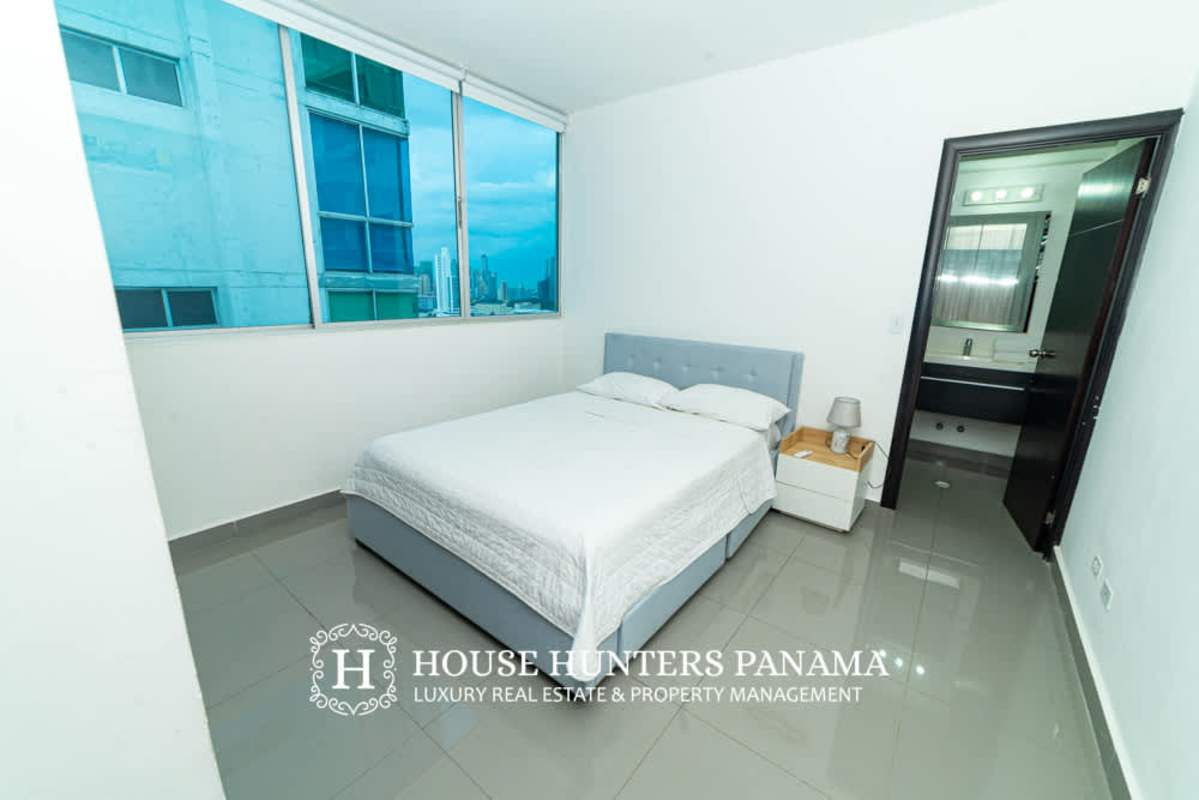 Bright bedroom with city views, large window and contemporary decor in PH Quartier 74 San Francisco Panama