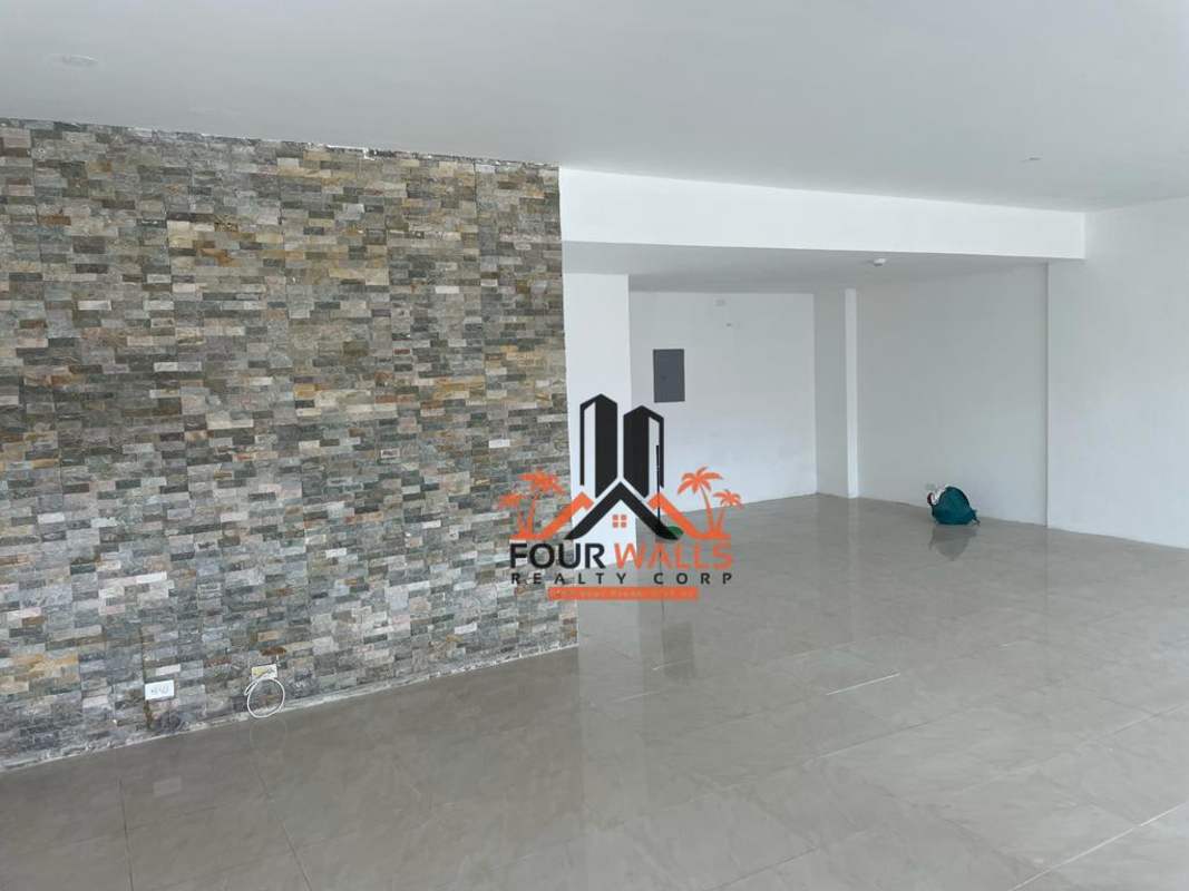 Open commercial premises with accent wall and tiled floor in Albrook Commercial Center Panama City