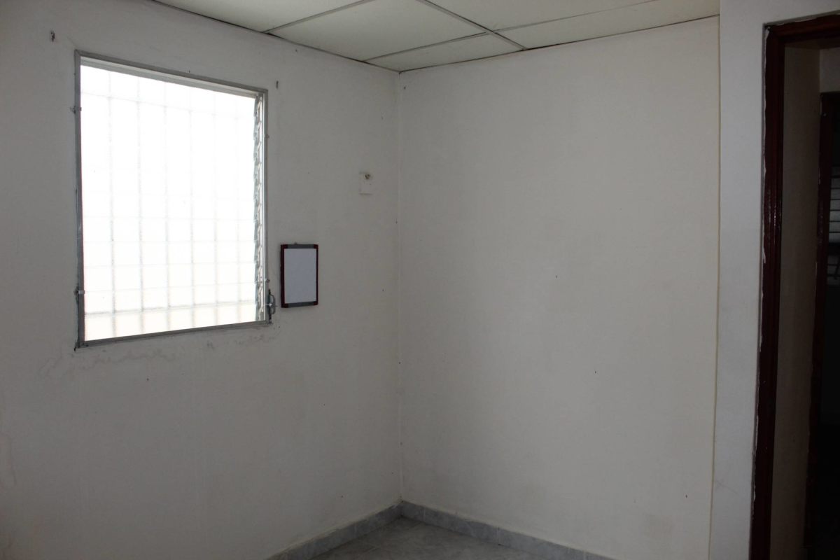 Bedroom with barred window, tiled flooring in Parque Real Las Mañanitas