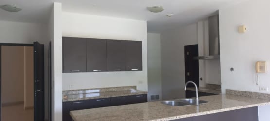 Bright living room with large sliding glass doors opening to balcony PH Soleo Panama