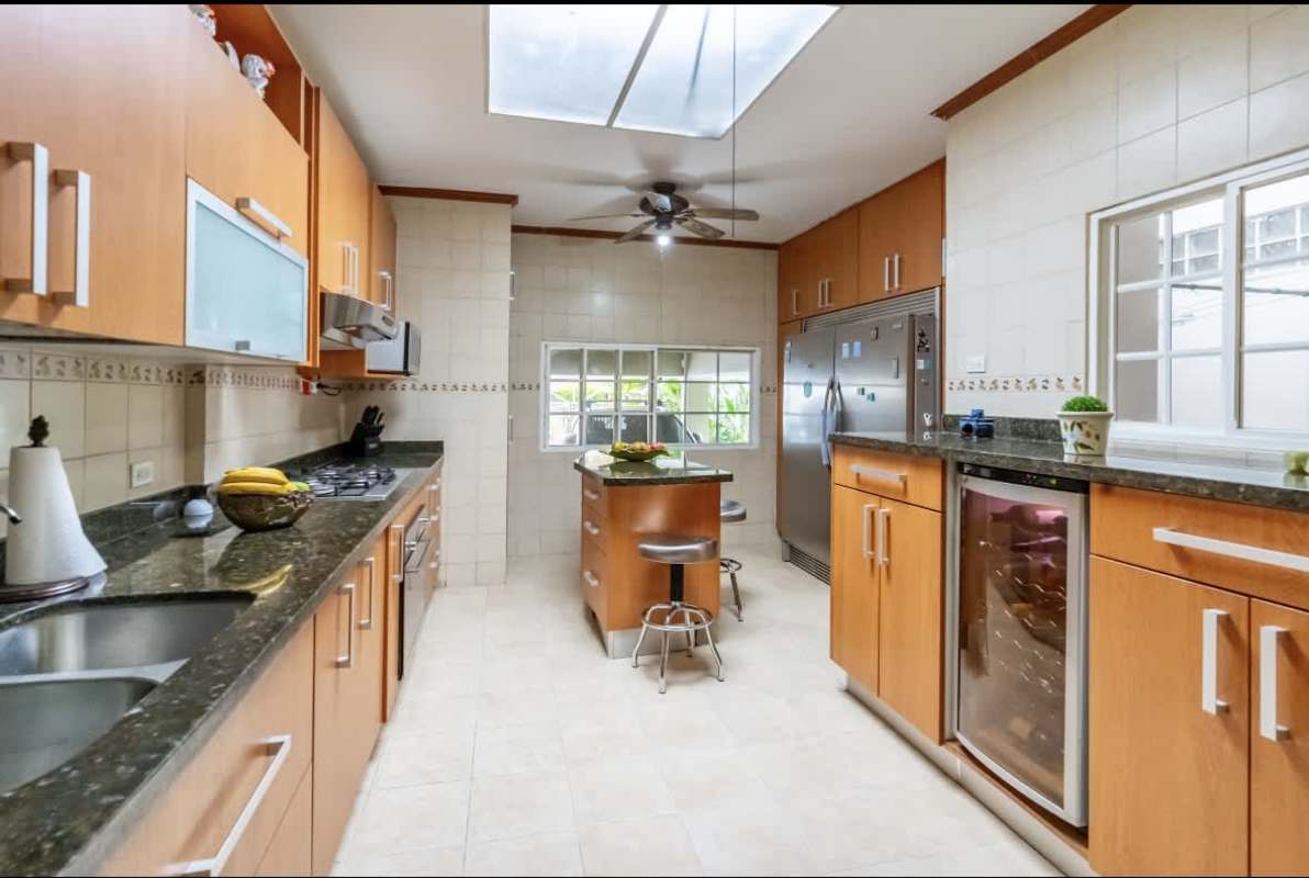 Bedroom with ensuite bathroom, ceiling fan, large closet in remodeled La Loma Panama house
