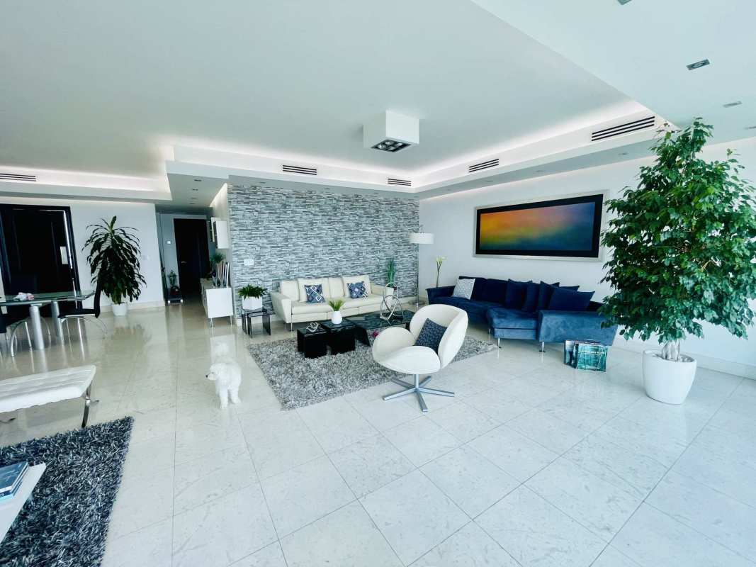 Modern living room with marble floors, panoramic windows with ocean view in PH Oceania Coast Costa del Este