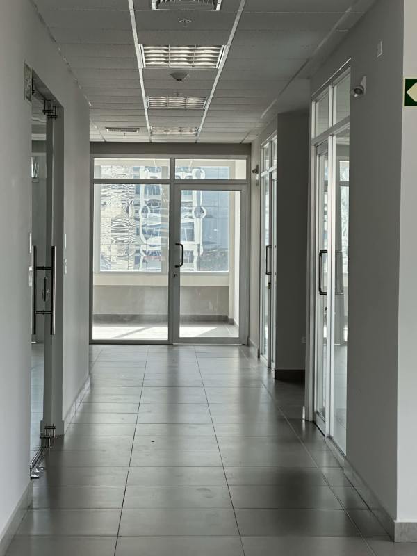 Glass walls and modern tile hallway in Class A business tower Costa del Este