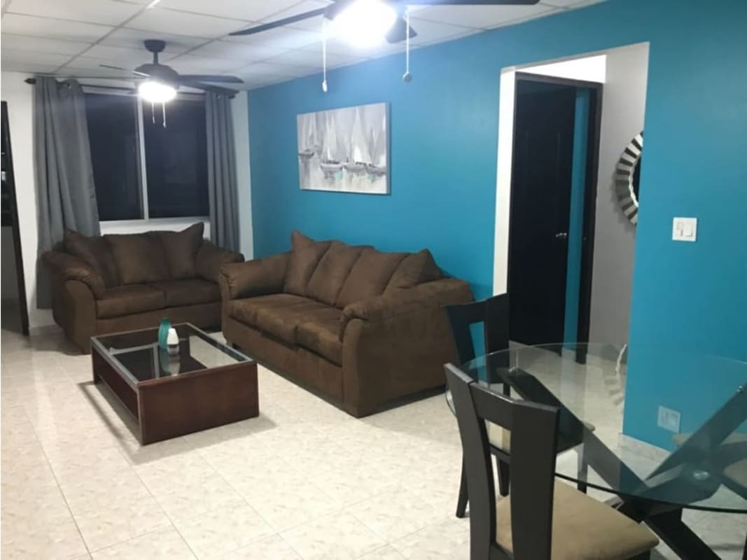 Contemporary living dining with sofas, blue accent, ceiling fans Betania Panama