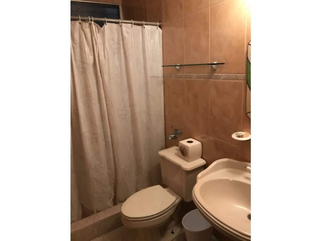 Bathroom with bathtub, beige tiles, mirror Betania Camino Real Panama