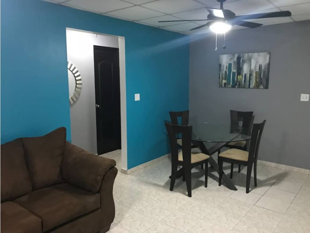 Small kitchen with wood cabinets, black granite counter, double sink Betania Panama