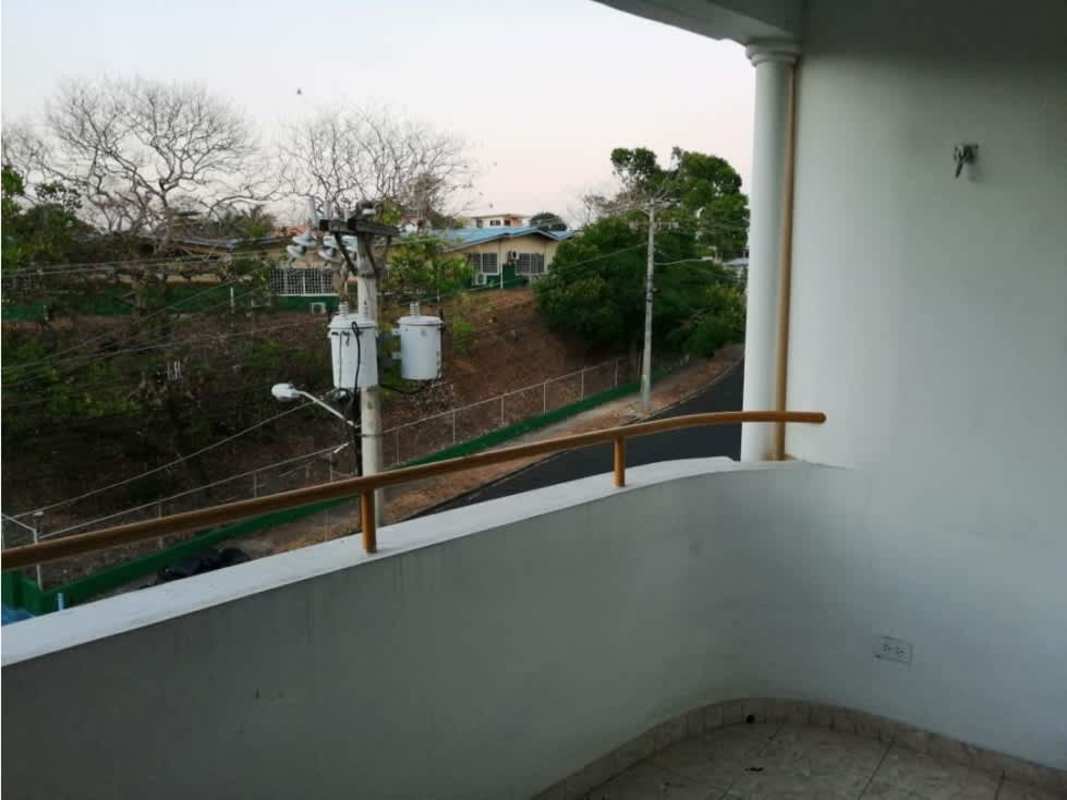 Curved balcony with railing, neighborhood street view Betania Panama