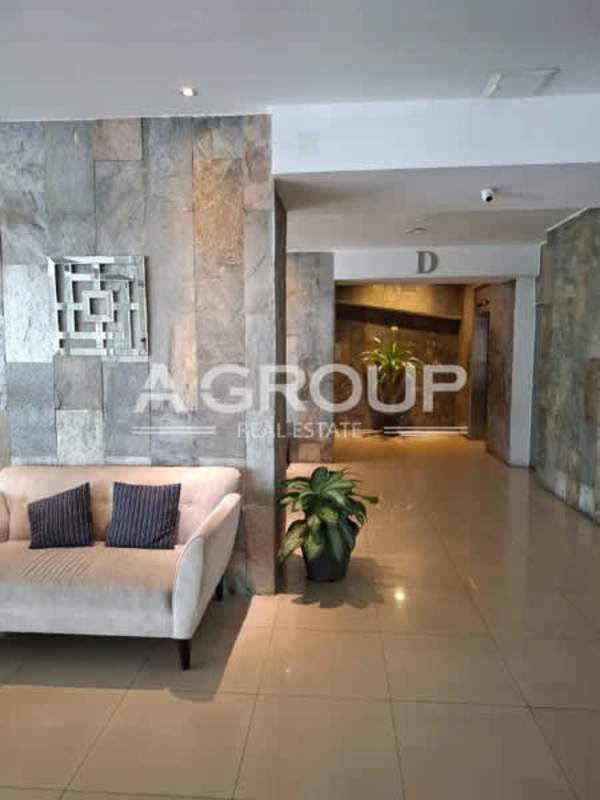 Modern living room with floor-to-ceiling windows, skyline city views at PH Harmony San Francisco Panama