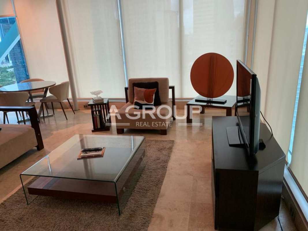 Modern bedroom with pendant lighting and wood floors in PH Loft Four 41 Punta Pacífica Panama