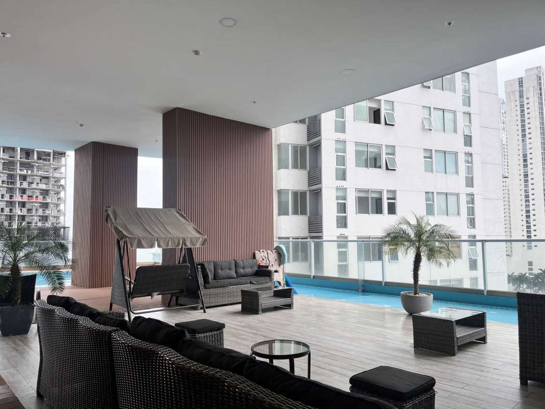 Balcony with glass railing overlooking Pacific Ocean and Panama skyline at PH Quartier del Mar