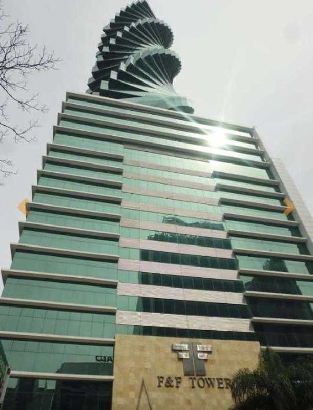 Modern twisting skyscraper F&F Tower exterior with green glass facade in Panama City