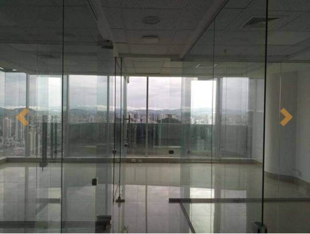 Spacious open-plan office area with floor-to-ceiling windows showing skyline in F&F Tower Panama City