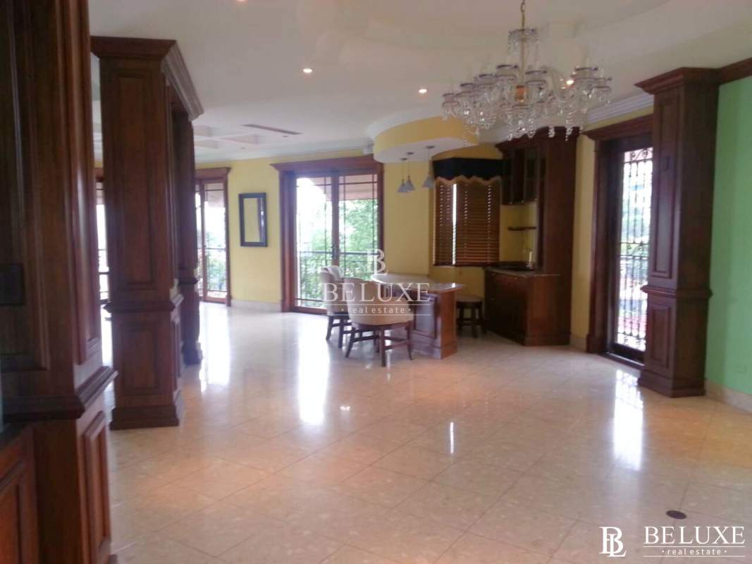 Multi-purpose room with built-in wood shelving and tiled floors El Dorado Panama