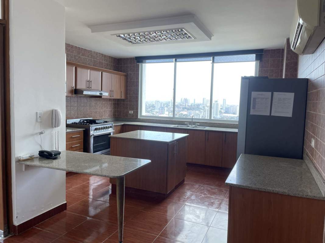Open living dining room with panoramic windows penthouse in PH Mont Royale Panama City