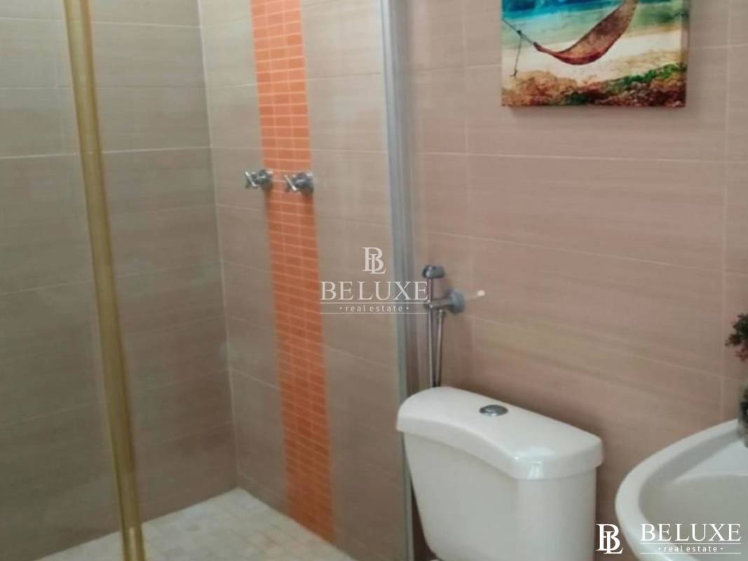 Bathroom with granite counter, glass shower and modern fixtures in PH Augusta Brisas del Golf