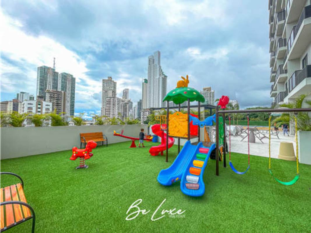 Outdoor play area with equipment and skyline view at PH The Gray Panama City