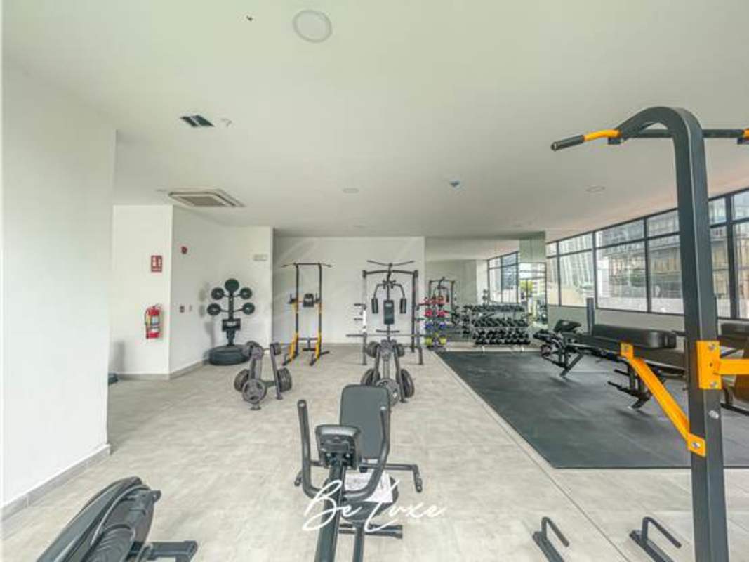 Stylish modern lobby with green wall and mirrors at PH The Gray Obarrio Panama City
