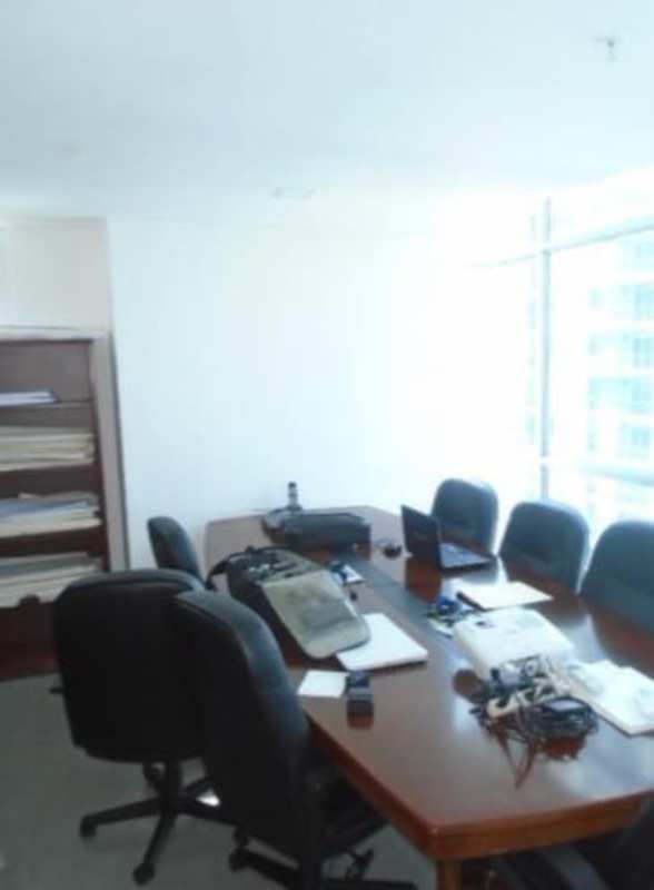 Spacious meeting room with large table, bookshelf and windows in PH Los Colores de Bella Vista Panama
