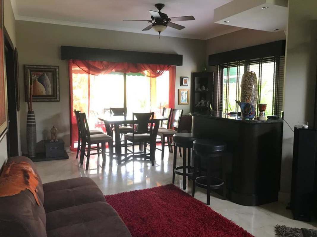 Terrace patio with fan, garden view, outdoor furniture, green awning in La Antigua Costa del Este