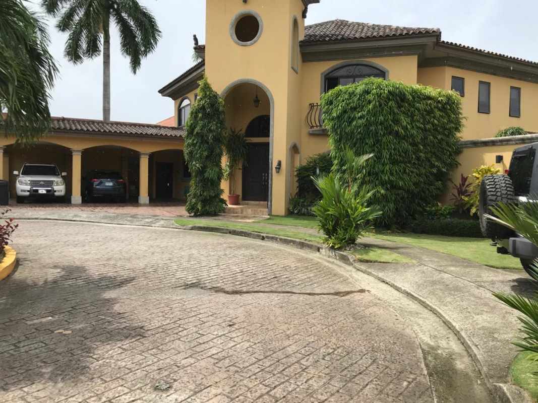 Elegant dining room with chandelier, marble floors, wood furniture in La Antigua Costa del Este