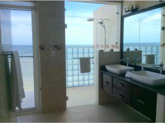 Exterior of Ocean Pearl hotel with balconies and stone staircase San Carlos Panama