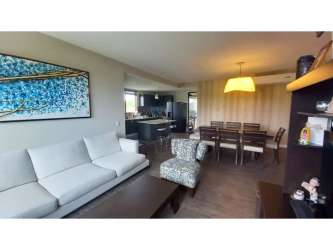 Contemporary living dining room open plan furnished in River Valley Panama apartment for sale