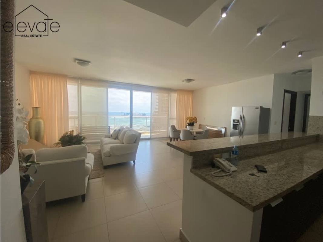Modern open-plan living dining with floor-to-ceiling ocean view windows PH Oceanaire Panama