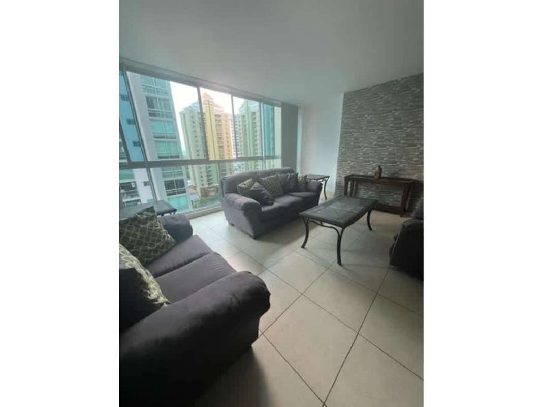 Kitchen with granite countertops, white cabinetry and appliances at Costa del Este Panama apartment