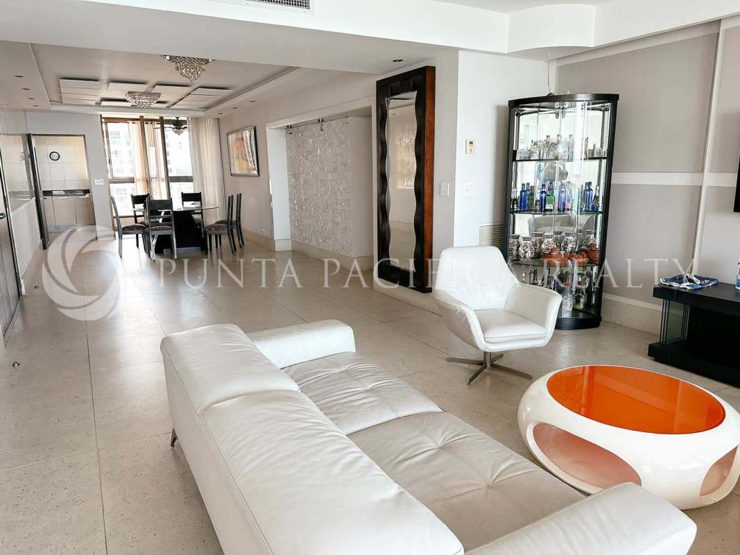 Sunroom balcony with ocean views, tile floors, ceiling fan, and seating in PH San Francisco Bay Panama