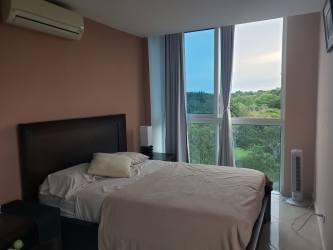 Furnished bedroom with ocean view and balcony PH Ibiza Playa Corona San Carlos Panama