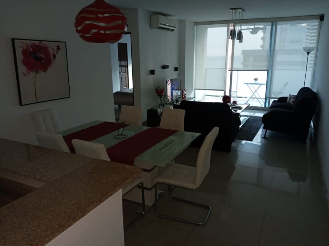 Bright open-plan living dining room with balcony in PH Pacific Sky