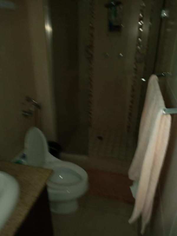 Small bathroom with walk-in shower and granite top in PH Pacific Sky