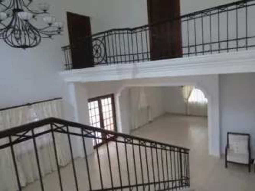 Bright remodeled kitchen with island and views to the garden in Clayton house