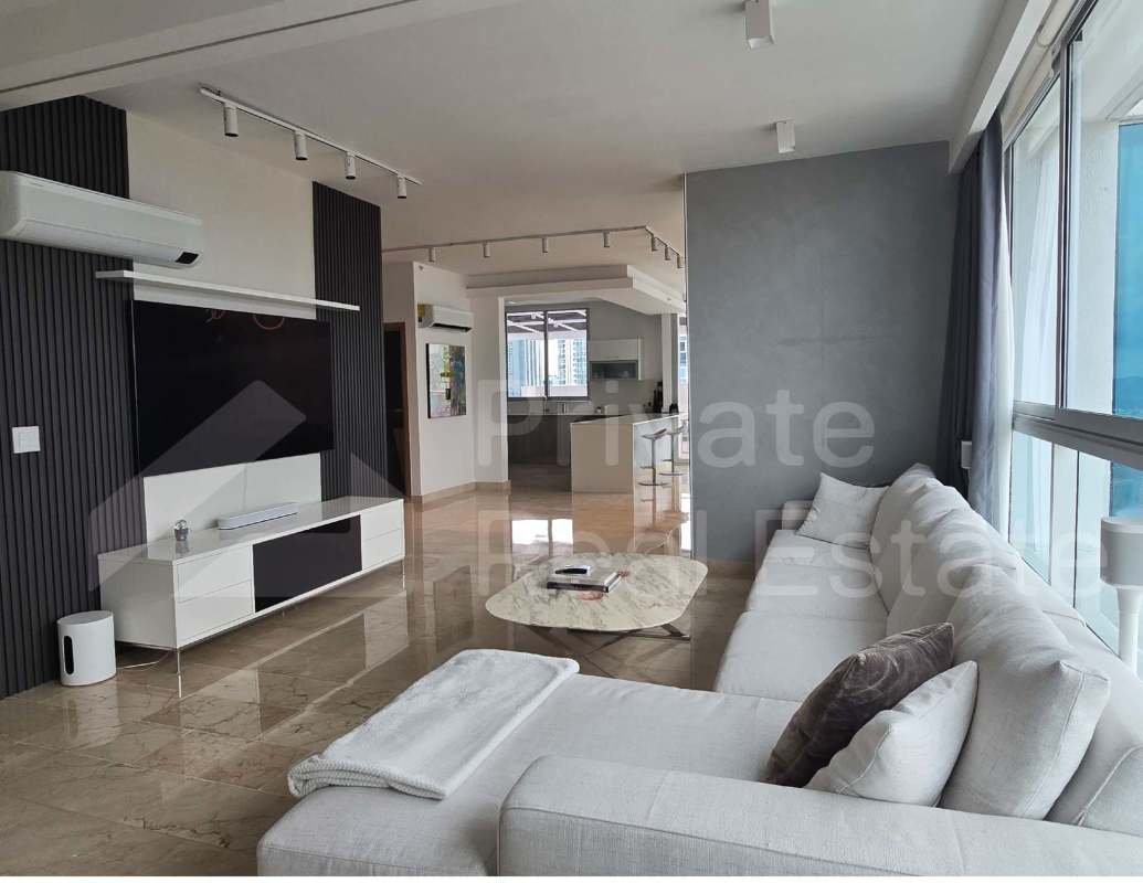 Modern open living and dining space with access to terrace in PH Dynasty Residences Panama City