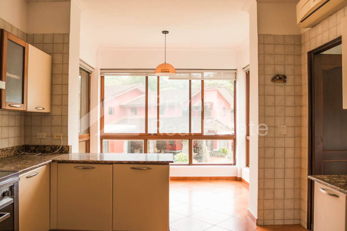 Bright granite kitchen beige tile large windows stainless appliances Camino de Cruces Panama