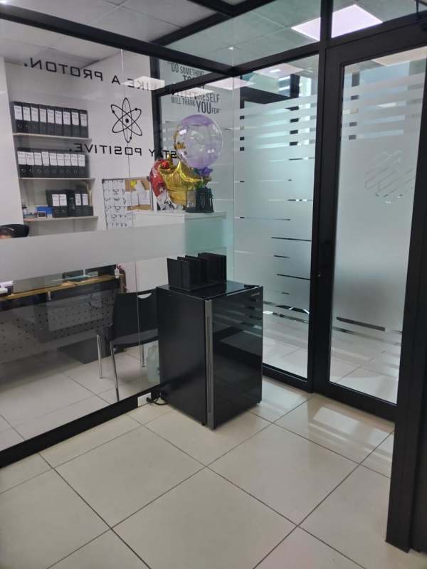 Modern office with desk, chair, glass partitions, whiteboard in PH Edison Corporate Panama