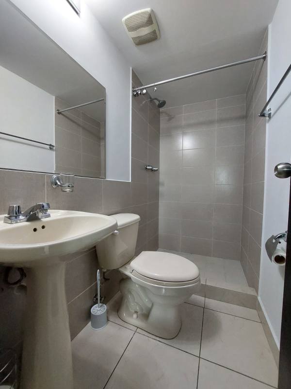 Lobby lounge with sofas, chandelier, large windows PH The Riverside Parque Lefevre Panama