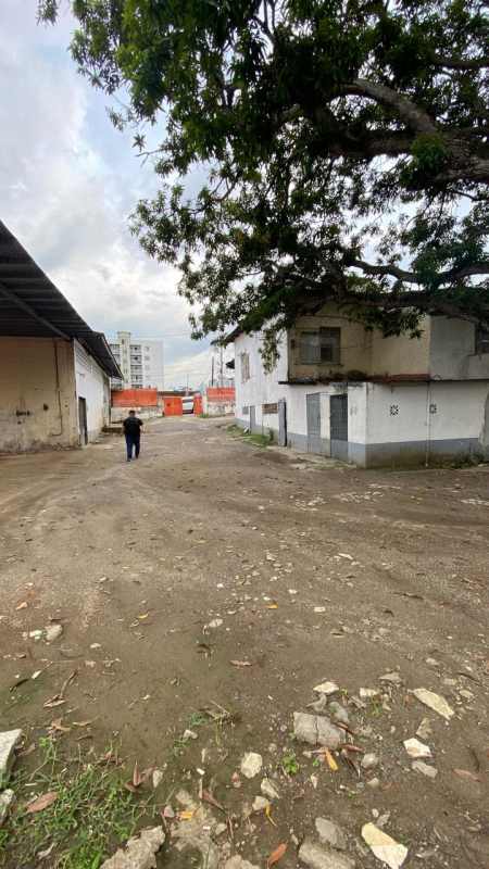 Large dirt yard and older storage buildings in industrial lot Parque Lefevre Panama