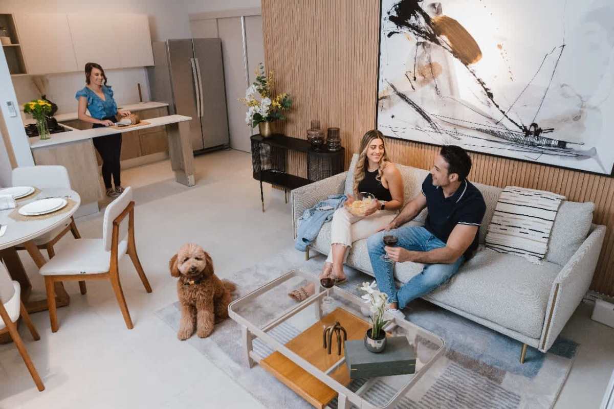 Open living and dining area with access to private balcony in PH Mi Condado Condado del Rey Panama