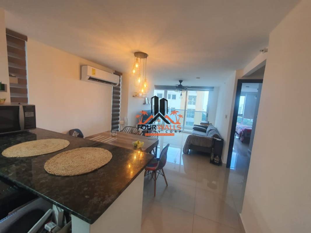 Modern open-concept living dining furnished apartment with balcony park views at PH Park Point