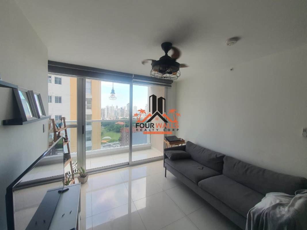 Open living area with ceiling fan and balcony access fully furnished at PH Park Point Panama