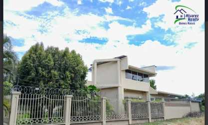 Two-story modern house with balcony and gated fence in David Chiriquí