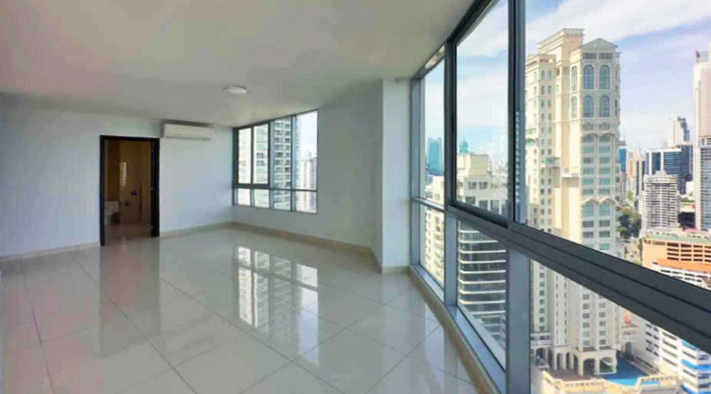 Modern kitchen with granite island and ocean backdrop in PH Allure Avenida Balboa Panama