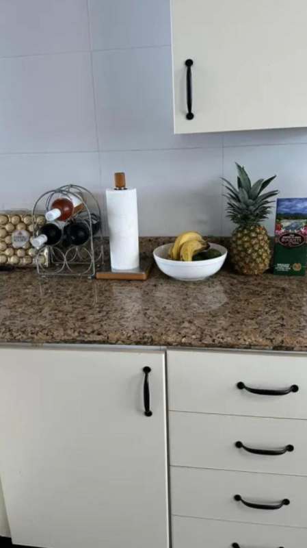 Bedroom with upholstered bed chandelier mirror wood floor PH Marina Park Panama