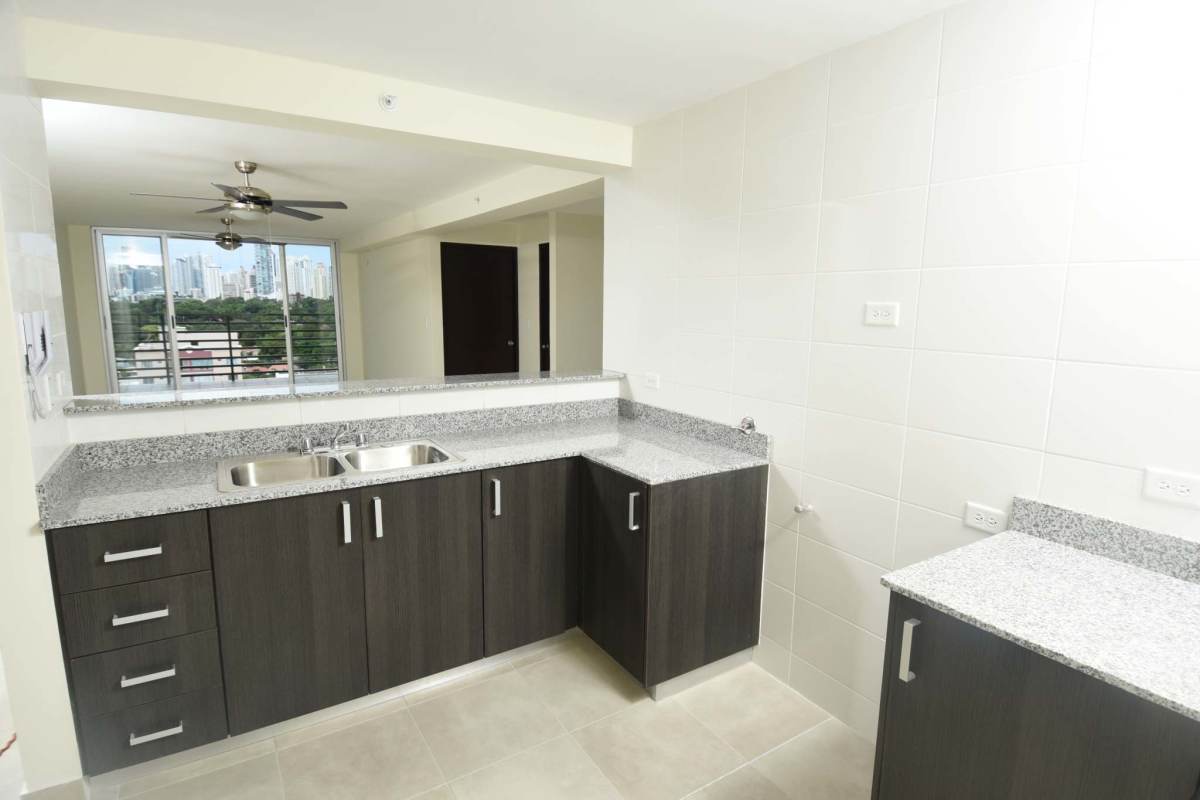 Granite kitchen countertops, dark wood cabinets, city view window PH Santerra Panama City