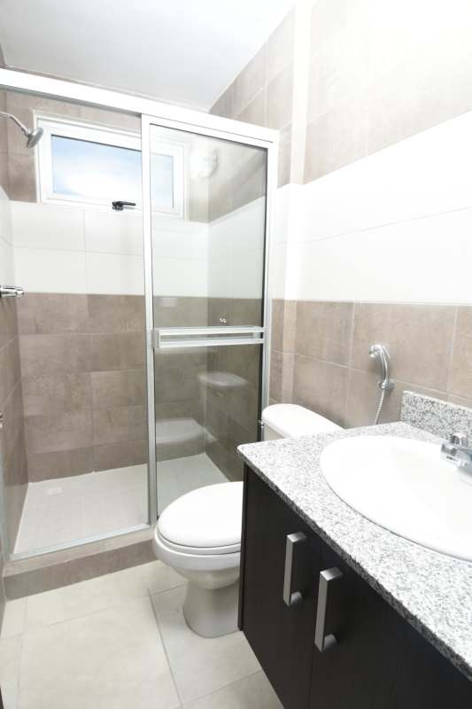 Contemporary bathroom with glass enclosure and granite counter PH Santerra Parque Lefevre